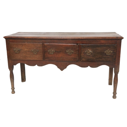 341 - An 18th Century oak Dresser Base, with plank top above three frieze drawers on turned legs, 63