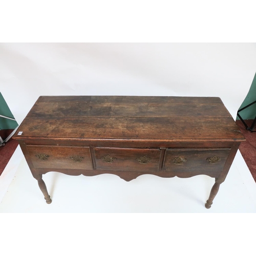 341 - An 18th Century oak Dresser Base, with plank top above three frieze drawers on turned legs, 63