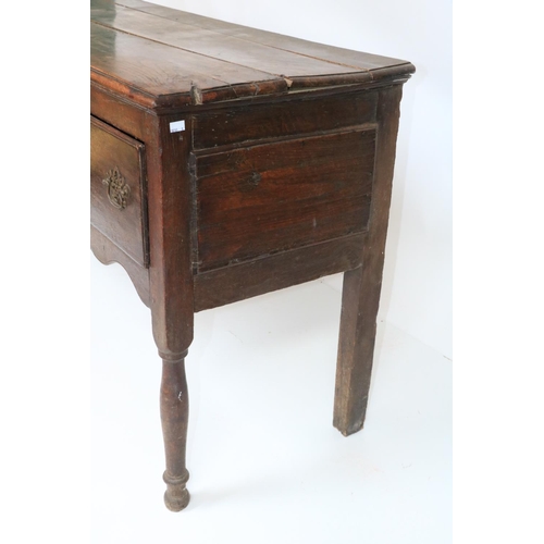 341 - An 18th Century oak Dresser Base, with plank top above three frieze drawers on turned legs, 63