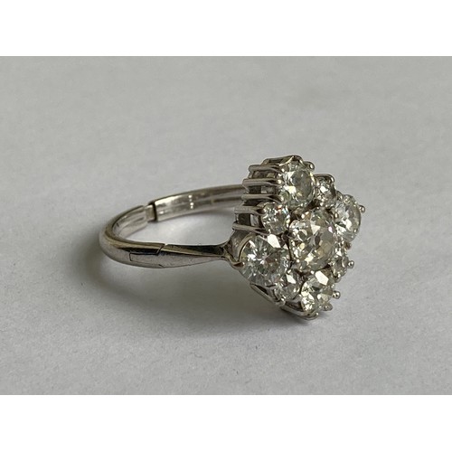 861 - An attractive Ladies diamond Ring, set in platinum, with 8 natural white diamonds (total carat weigh... 