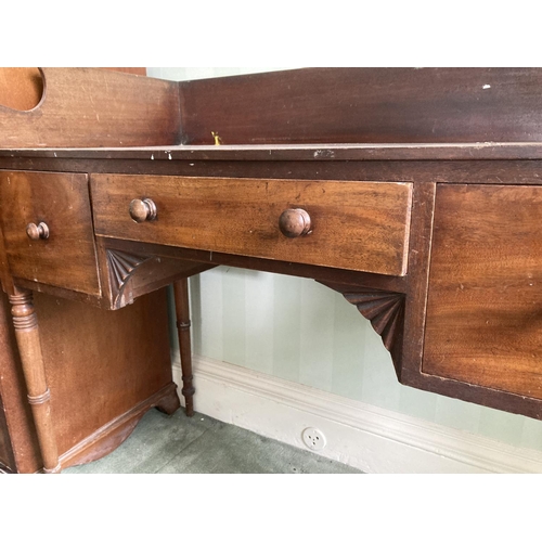 168 - A William IV period mahogany kneehole Dressing Table, with three-quarter gallery and three frieze dr... 