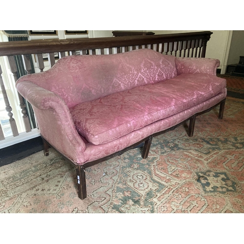 219 - A Georgian style mahogany framed humpback Settee, covered in pink damask fabric, with scrolled arms,... 