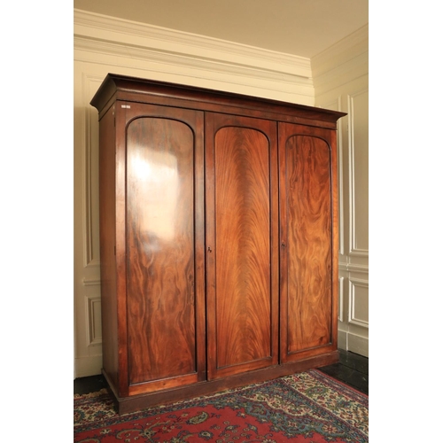 270 - A fine quality Victorian mahogany Wardrobe, with three arched panel doors on a plinth base, 84