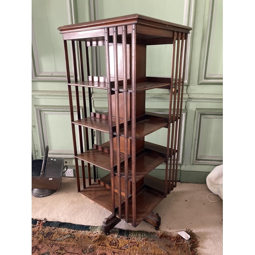 293 - An early Edwardian walnut Revolving Open Bookcase, with slatted dividers on quadruple pod, approx. 5... 