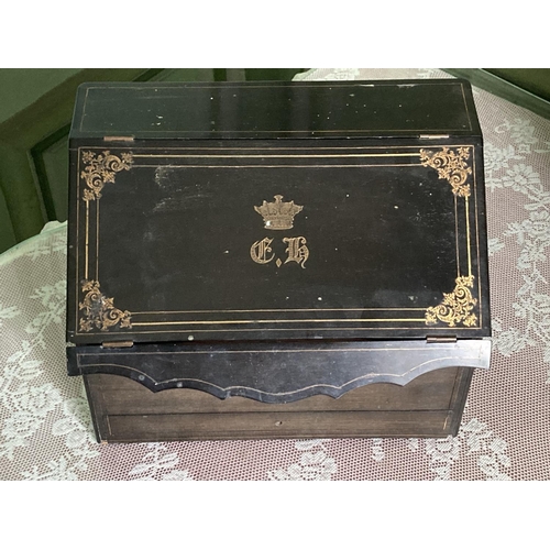 297 - A brass inlaid ebonised slope front Stationary Box, with inlaid brass coronet and monogram, 12