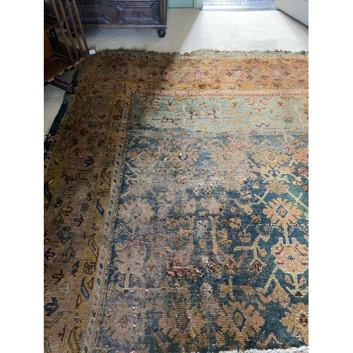 298 - A large Turkish Ushak wool Carpet, with all over pattern of stylized flowers and hooked gulls on a d... 