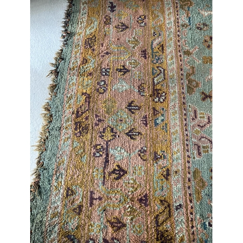 298 - A large Turkish Ushak wool Carpet, with all over pattern of stylized flowers and hooked gulls on a d... 