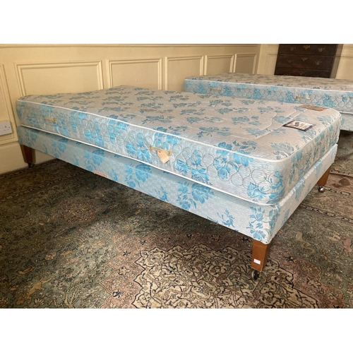 300 - Two single Beds, by Hiltonia, covered in blue fabric, 6' x 3', sold as a lot, w.a.f. (2)... 