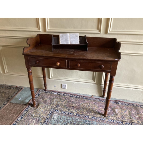 302 - A William IV period mahogany Dressing Table, with three-quarter gallery above two frieze drawers on ... 