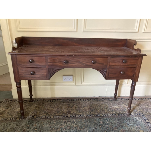 302 - A William IV period mahogany Dressing Table, with three-quarter gallery above two frieze drawers on ... 