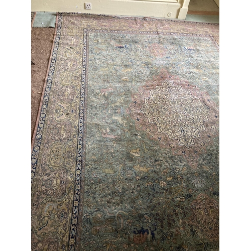 305 - A pair of Oriental style machine made lime ground Carpets, each with pink and ivory medallion centre... 