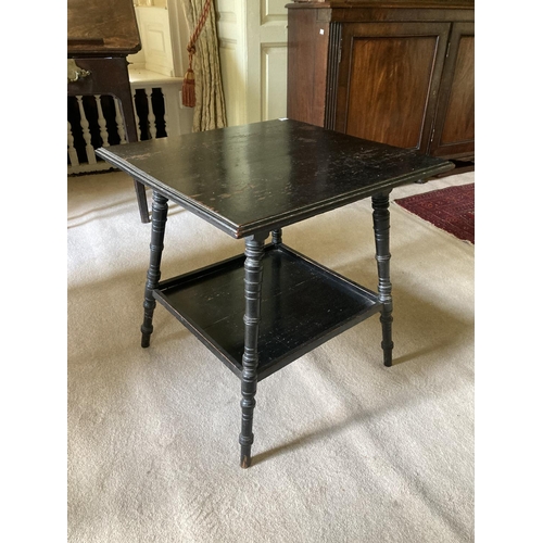 349 - A small square ebonised two tier Aesthetic movement Occasional Table, on four turned legs, united by... 