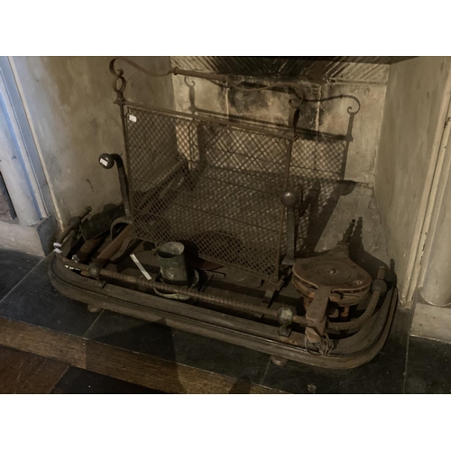 427 - A small cast iron Fender, with open top rail, a wire mesh Spark Guard, a pair of Andirons, and a Bel... 