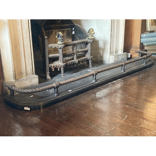 438 - WITHDRAWN...A 19th Century cast iron Fender, with rope cast top rail and moulded base, 6' (183cms) w... 