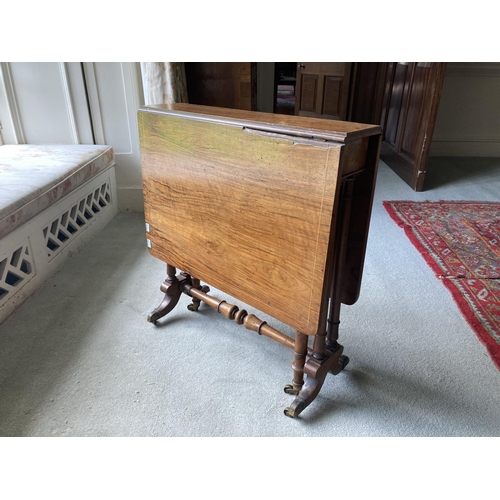 447 - A William IV period inlaid walnut Sutherland Table, the rectangular top with two drop flaps, on a pu... 