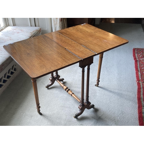 447 - A William IV period inlaid walnut Sutherland Table, the rectangular top with two drop flaps, on a pu... 