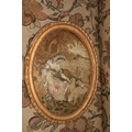 An important large pair of 19th Century oval needlework Tapestries, depicting 