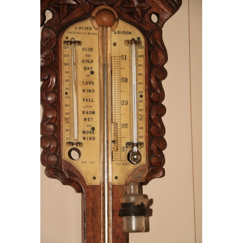 484 - A quality Victorian oak framed Stick Barometer, with arched and pierced capital, by J. Hicks, 8, 9 &... 