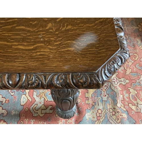 577 - A Victorian period Cromwellian style extending Dining Table, with three spare leaves, the carved edg... 