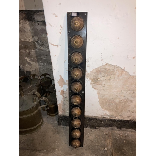 615 - A rare set of 10 early electric brass Light Switches, each of circular reeded form on oblong ceramic... 