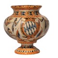 An early Castelli Majolica bulbous Vase, of small proportions, decorated with winged figures, on cir... 
