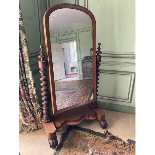 289 - A Victorian mahogany Cheval Mirror, with arched plate on two spiral twist supports, on a serpentine ... 