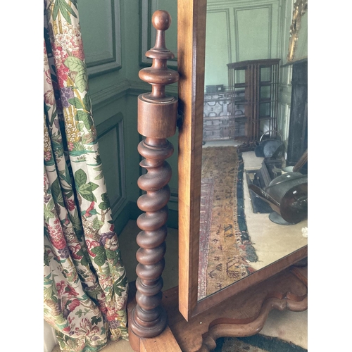 289 - A Victorian mahogany Cheval Mirror, with arched plate on two spiral twist supports, on a serpentine ... 