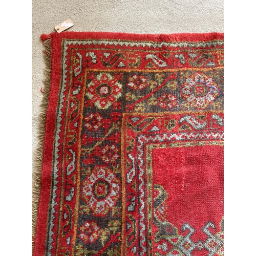 472 - A large semi-antique Turkish Ushak, with geometric design centre and with conforming border, approx.... 