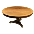 A Regency period rosewood inlaid and crossbanded Breakfast Table, with circular flip top raised on a... 