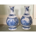 A fine pair of blue and white early 18th Century Delft Vases, each decorated with hunting scenes and... 