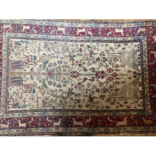 579 - A fine quality Persian Rug, part silk, with all over tree of life design, with colourful exotic bird... 