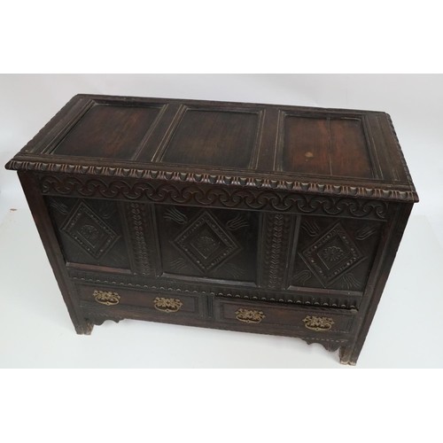 627 - An early 18th Century oak Coffer, the top with three recessed panels, and a moulded rim, above a fro... 