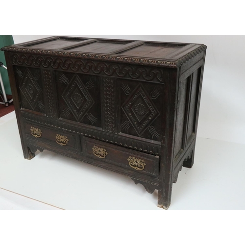 627 - An early 18th Century oak Coffer, the top with three recessed panels, and a moulded rim, above a fro... 