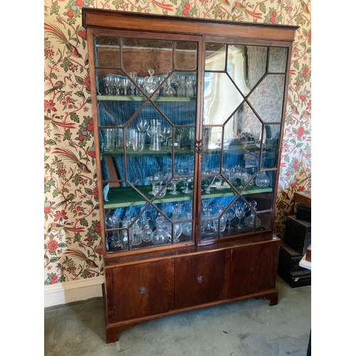 892 - A mahogany Bookcase, on base, 19th Century and later, with two astragal glazed doors on a base with ... 