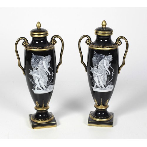 235 - An attractive pair of 19th Century tall two handled French porcelain Vases, with lids, each with gil... 