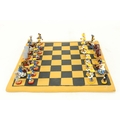 A very unusual Chess Set, with earthenware tile chessboard, and 32 very small hand made earthenware ... 