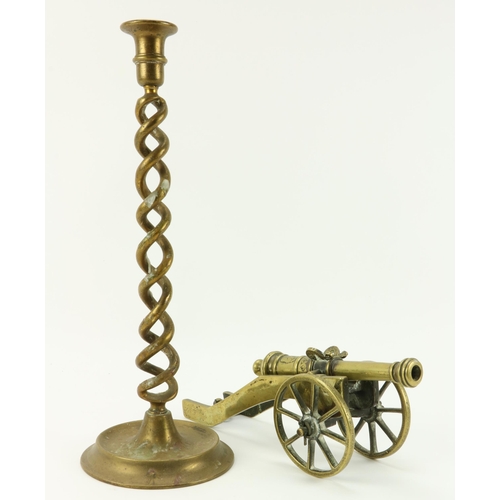 12 - A heavy brass Desk Cannon, with engraved decoration; and a tall twisted brass Candlestick, 40cms (15... 