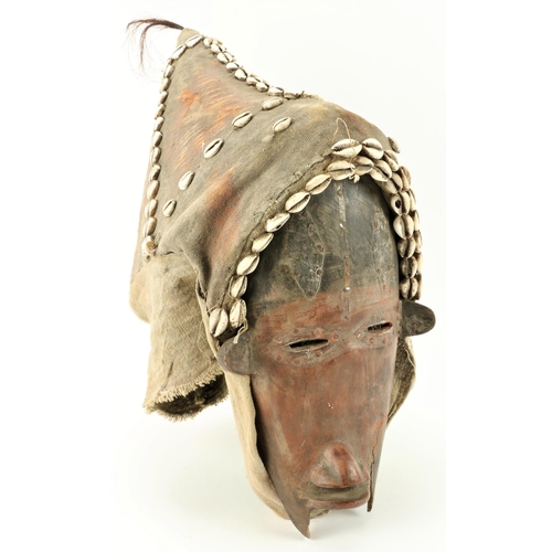 14 - A rare and unusual early 20th Century West African Dan Mask, with slit eyes and fiber headdress cove... 