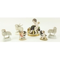 An early 19th Century porcelain Figure of Cupid, holding grapes and two begging rabbits; a pair of s... 