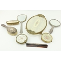 A three piece silver mounted Dressing Table Set, to include mirror, brush and comb; together with a ... 