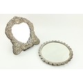 An attractive modern shield shaped silver Dressing Table Mirror, with profusely embossed frame; and ... 