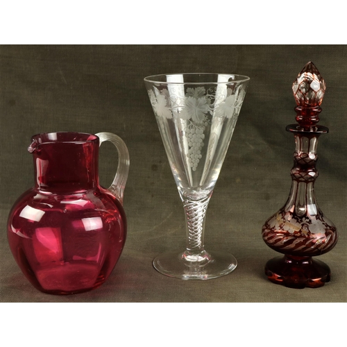 232 - A Bohemian ruby glass and vine engraved Perfume Bottle and stopper, (as is), a cranberry glass Jug a... 