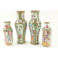 A pair of Cantonese porcelain Vases, decorated with figures, flowers, birds, etc., 29cms (11 1/2