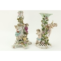 A Sitzendorf porcelain Table Lamp, with flowers and two cupids surmounted; and a Sitzendorf Centerpi... 