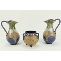 An attractive pair of Doulton Lambeth stoneware Jugs, with blue and green ground and gilt decoration... 