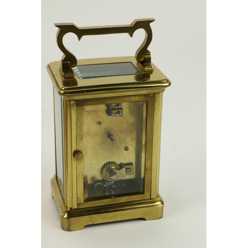 74 - A small brass Carriage Clock, the front enamel dial signed Weir & Sons, Dublin, in original leat... 