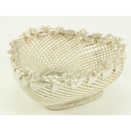 77 - A First Period Belleek floral Basket, with strap mark. (1)