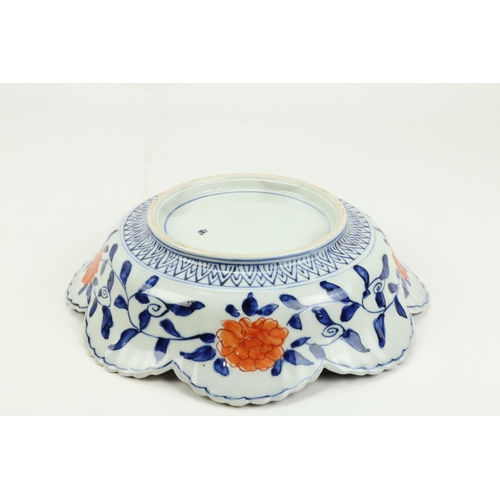 79 - An unusual Imari Bowl, with shaped serrated rim and with fan shaped center, decorated with flowers, ... 