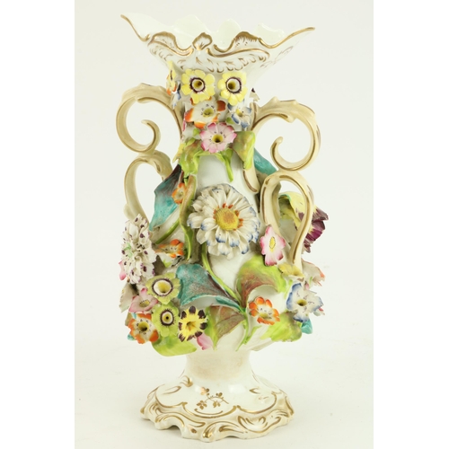 84 - An attractive 19th Century English porcelain Vase, profusely encrusted with flowers, 23cms (9