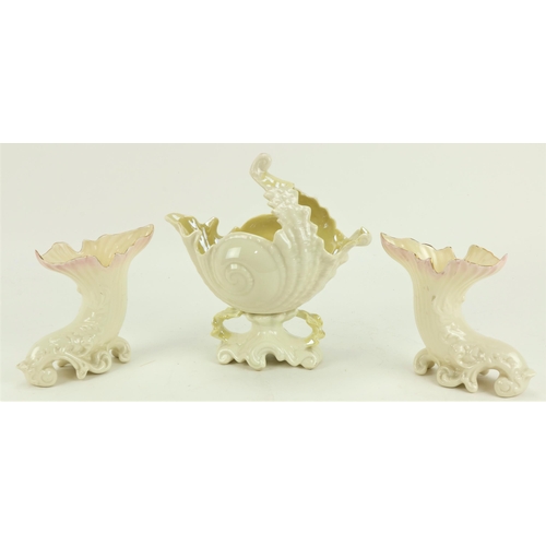 85 - A large Belleek shell shaped Bowl, and a pair of cornucopia shaped Vases, all modern Belleek. (3)... 